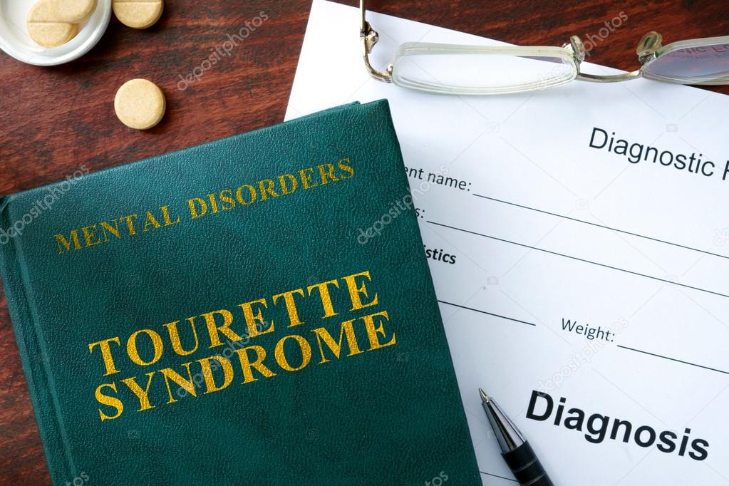 Tourette syndrome concept. Diagnostic form and book on a table.