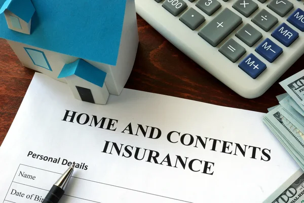 Home and contents insurance  form and dollars on the table. — Stock Photo, Image