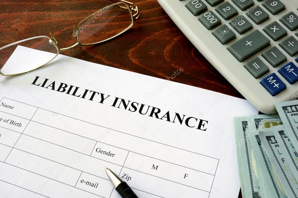Liability insurance  form and dollars on the table.