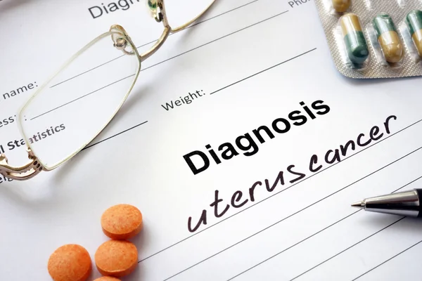 Diagnosis uterus cancer written in the diagnostic form and pills. — Stock Photo, Image