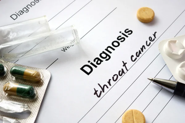 Diagnosis throat cancer  written in the diagnostic form and pills. — Stock Photo, Image