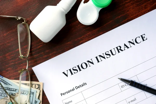 Vision insurance form on the wooden table. — Stock Photo, Image