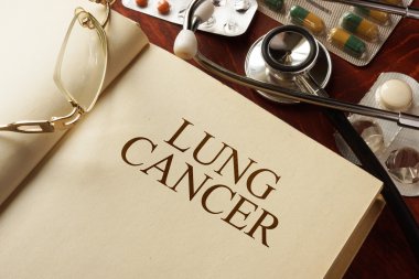 Book with diagnosis  lung cancer. clipart