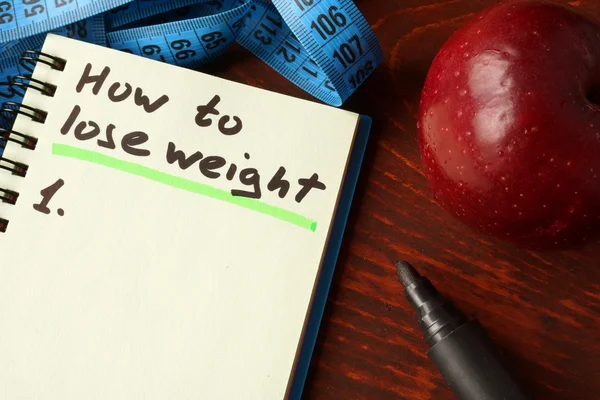 Notebook z jak stracić waga znak. Pojęcie diety. — Zdjęcie stockowe