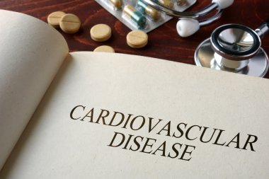 Book with diagnosis cardiovascular disease and pills. clipart
