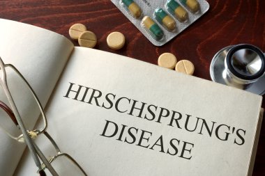 Book with diagnosis Hirschsprung disease and pills. clipart
