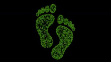 Siyah arka planda büyüyen yeşil çimen etkisine sahip insan ayak izleri sembolü