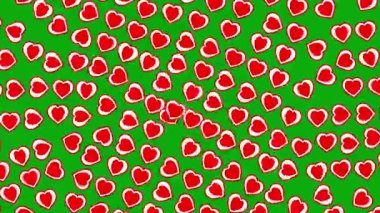 Expanding red hearts motion graphics with green screen background