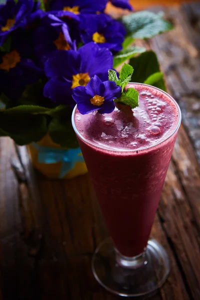 Delicious berry smoothie on table — Stock Photo, Image