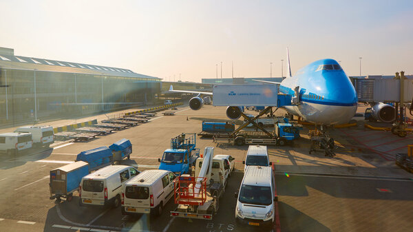 KLM plane being loaded at Schiphol Airport. Amsterdam, Netherlands