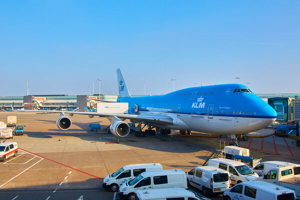 KLM plane being loaded at Schiphol Airport. Amsterdam, Netherlands