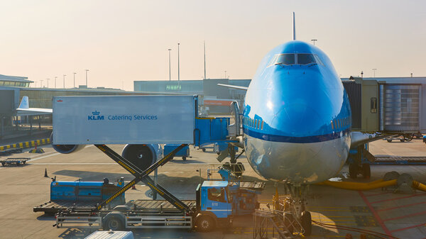 KLM plane being loaded at Schiphol Airport. Amsterdam, Netherlands