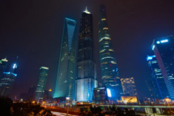 Shanghai skyline på natten ur fokus. — Stockfoto
