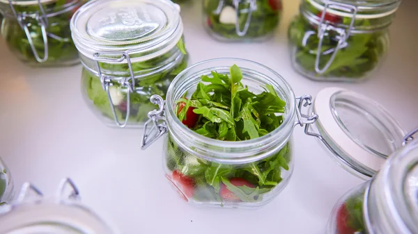 Vegetable salad in glass jar on white background — Stock Photo, Image