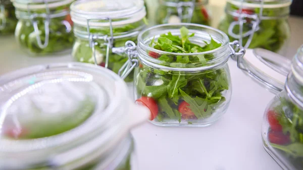 Vegetable salad in glass jar on white background — Stock Photo, Image