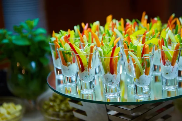 Colorful slices of raw vegetables in glasses — Stock Photo, Image