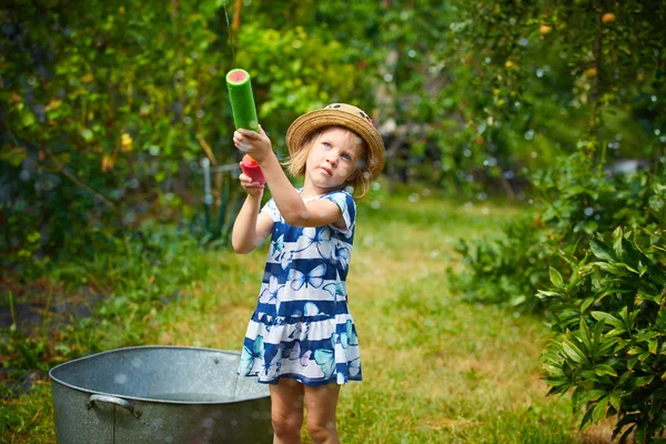 Nice girl playing with water gun — Stock Photo, Image