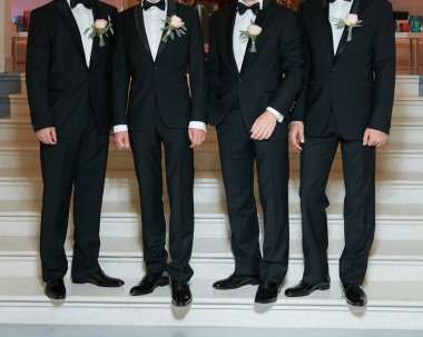 Groom With Best Man And Groomsmen At Wedding clipart