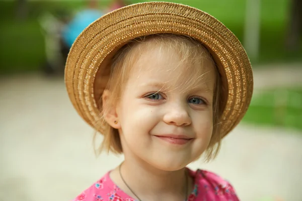 Cute kid girl wearing hat outdoors — Stock Photo, Image