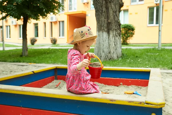 Child on playground in summer park — Stock Photo, Image