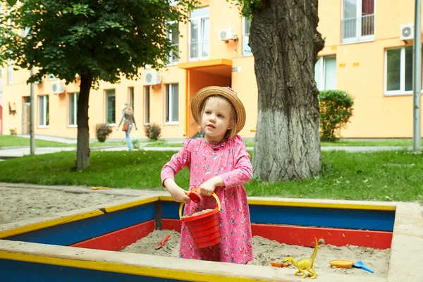 Child on playground in summer park — Stock Photo, Image