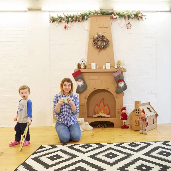 Story Time with Mother and Son in Front of Fireplace — Stock Photo, Image