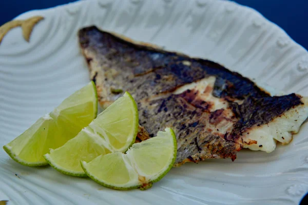 The white fish on plate with lime. Kosher food. Shallow dof. — Stock Photo, Image