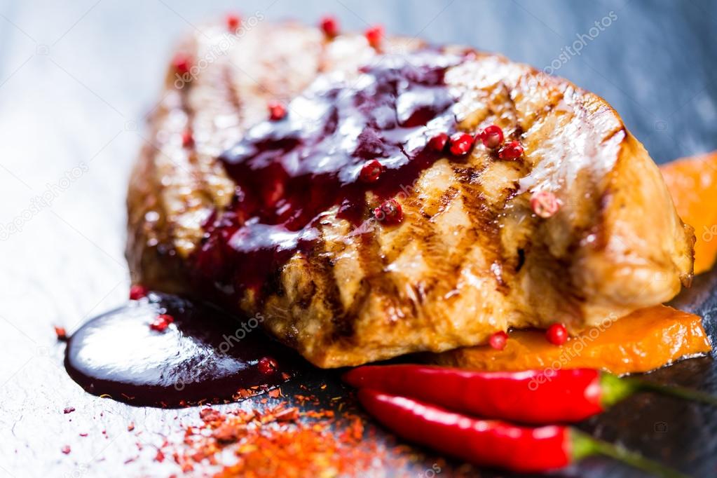 Deer steak with cranberries sauce — Stock Photo © sarymsakov 56257215