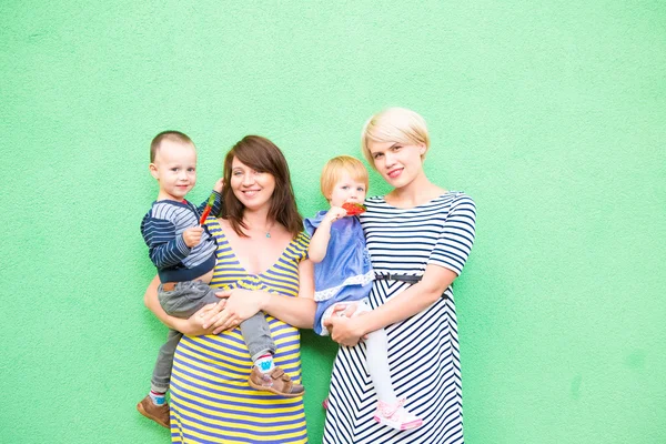 Two beautiful girls with a children — Stock Photo, Image