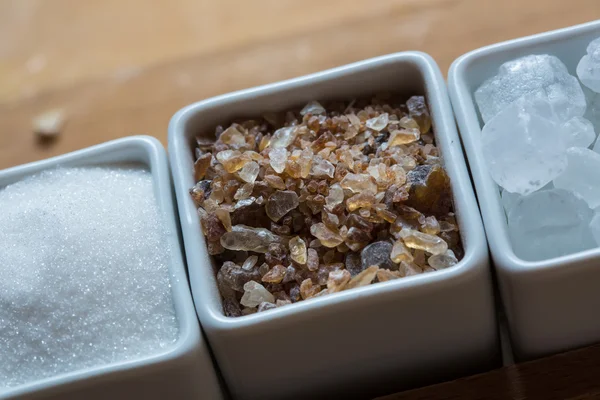 White and brown sugar on wooden table. — Stock Photo, Image