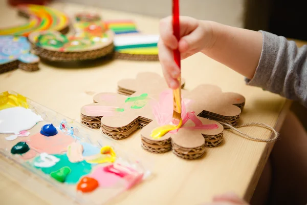 Little female baby painting with colorful paints — Stock Photo, Image