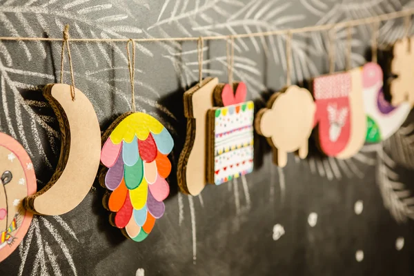 Cardboard toys for the Christmas tree or garland. Creative decorations. Selective Focus — Stock Photo, Image