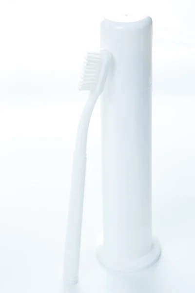 Toothpaste and toothbrush over white — Stock Photo, Image