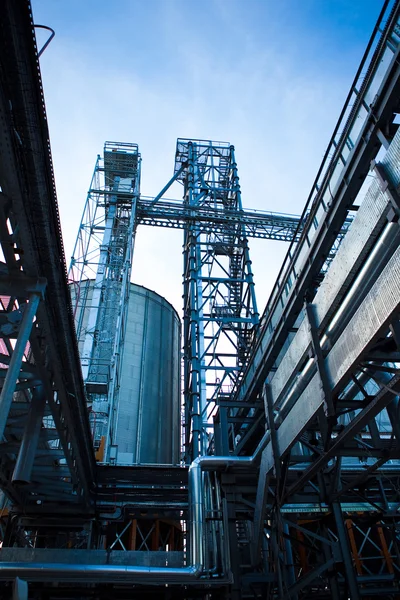 Towers of grain drying enterprise at sunny day — Stock Photo, Image