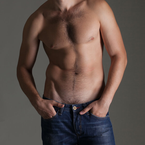 Sexy muscular naked man in jeans