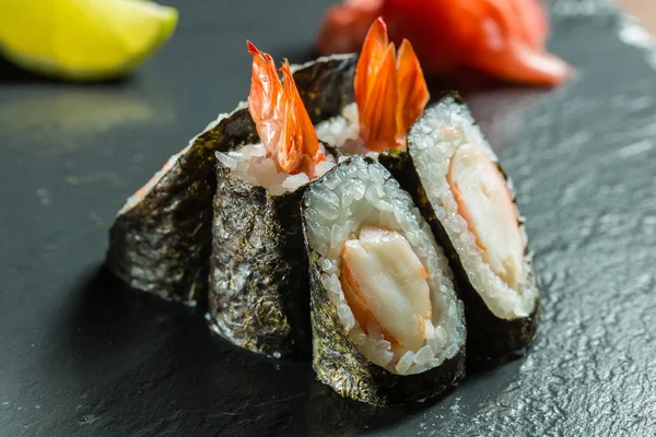 Rolls with shrimp on the black — Stock Photo, Image
