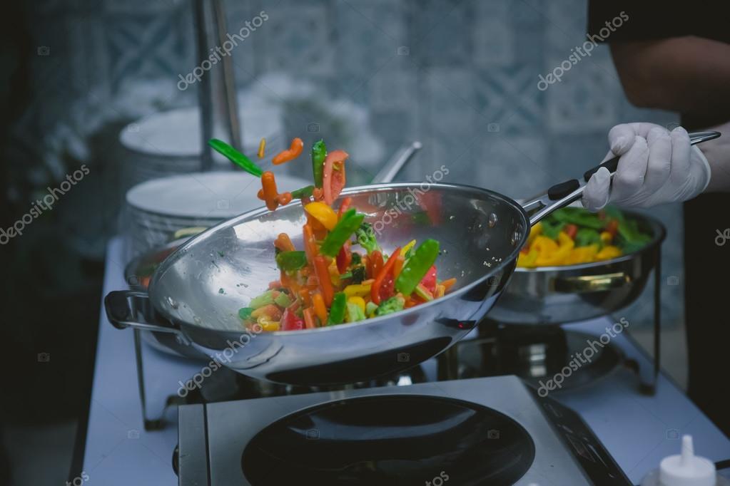 Cooking vegetables in wok pan — Stock Photo © sarymsakov 74067819