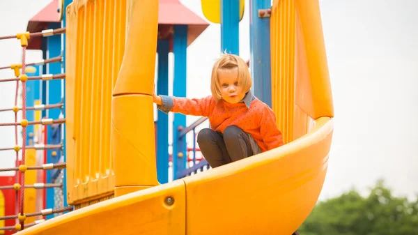 Outdoor portrait of adorable little girl playing in park Stock Picture