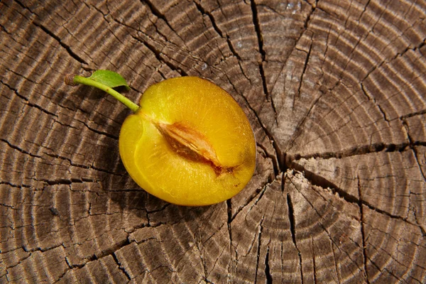 Fresh plum on wooden table — Stock Photo, Image