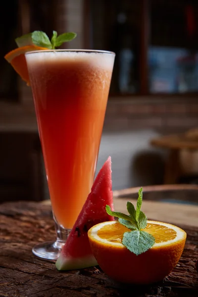 Glass watermelon and orange smoothie — Stock Photo, Image