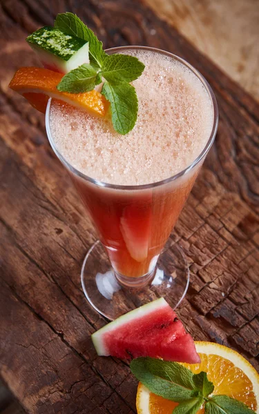 Glass watermelon and orange smoothie — Stock Photo, Image