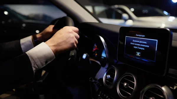 Hands on a steering wheel — Stock Photo, Image