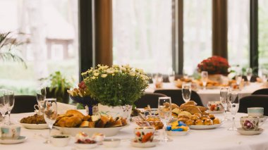 A beautiful table set for an autumn celebration. A concept for family gatherings, togetherness, and the cozy hygge lifestyle