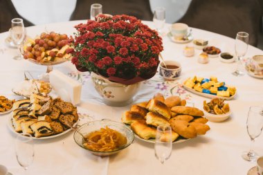 A beautiful table set for an autumn celebration. A concept for family gatherings, togetherness, and the cozy hygge lifestyle