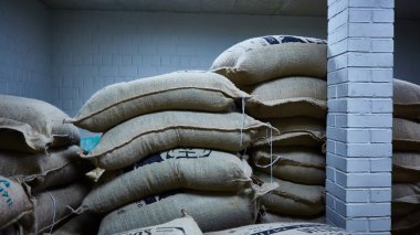 stack of burlap sacks with coffee beans clipart