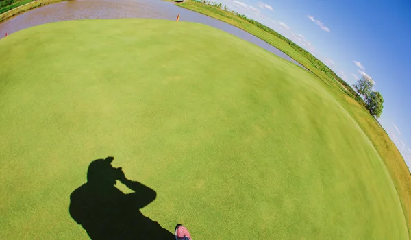 Photographer shadow with grass background — Stock Photo, Image