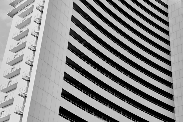 Angle view to textured background of modern glass building — Stock Photo, Image