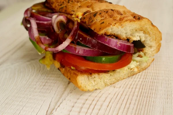 Sandwiches with salad, onion, salami, pepperoni, ham, cheese — Stock Photo, Image