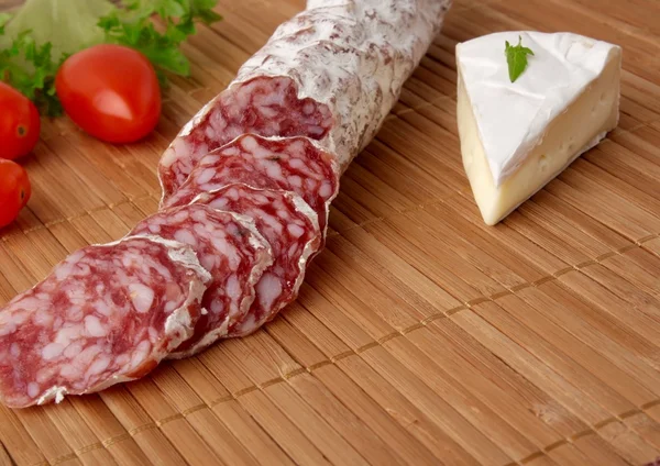 Salami camembert  on a wooden background — Stock Photo, Image