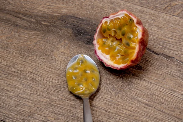 Passion fruits juice on wooden background